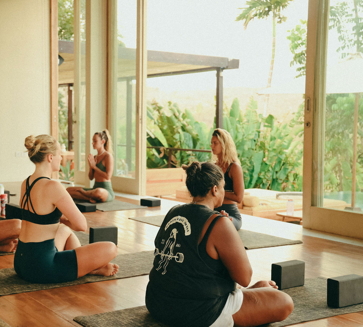 Girls doing yoga on surf & yoga retreat in Lombok