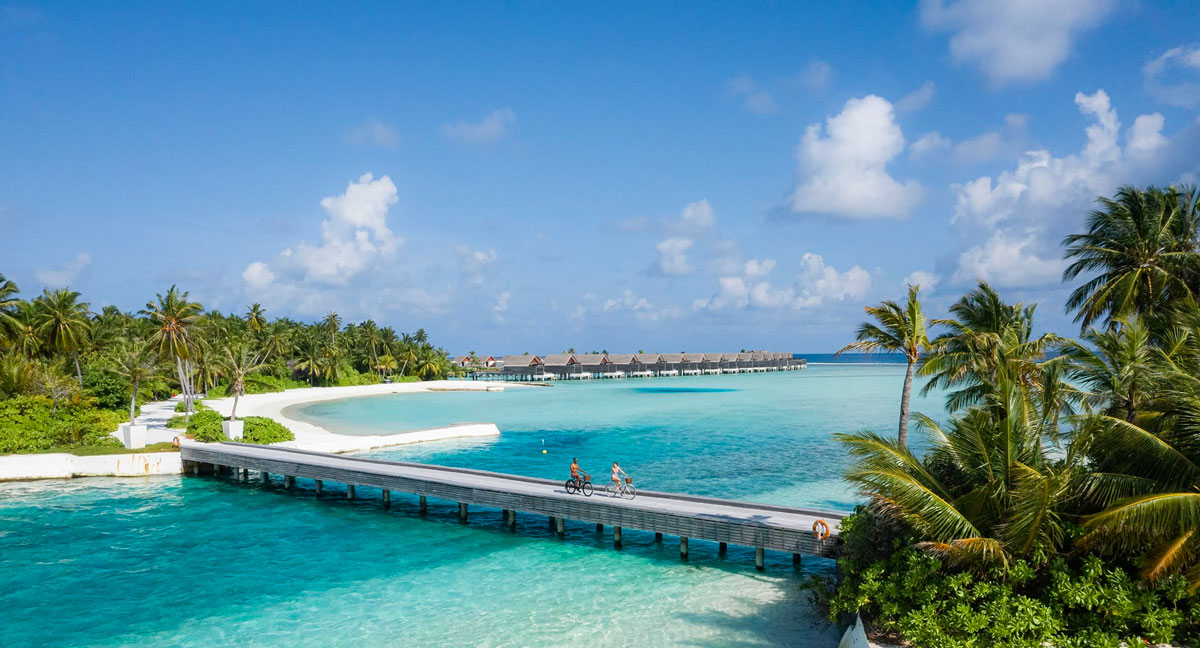•-niyama-private-islands---bridge-with-couple-cycling