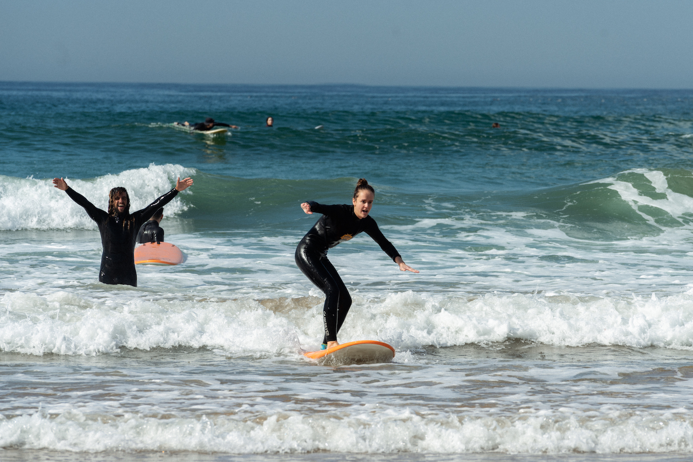 A girl learning how to surf at Blue Mind Morooco