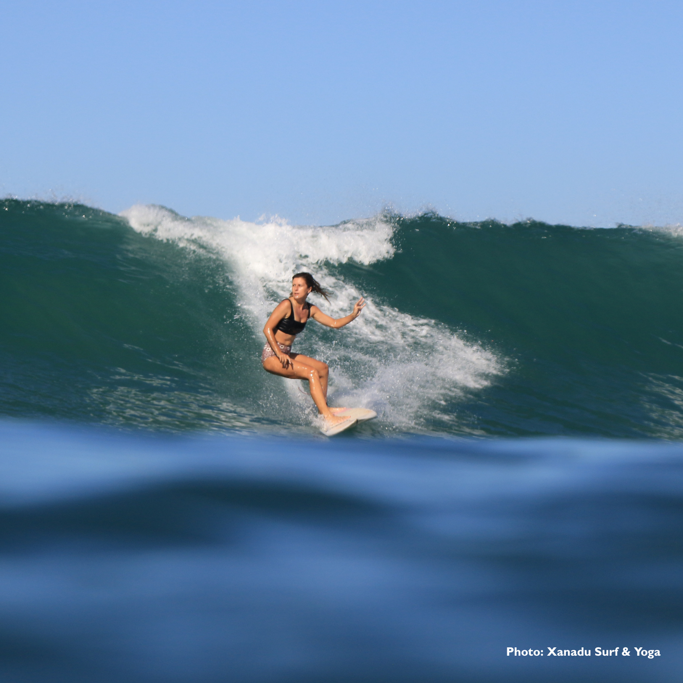 An advanced surfer at Goddess Retreats An image to show the advanced surfer level in our progress your surfing guide.