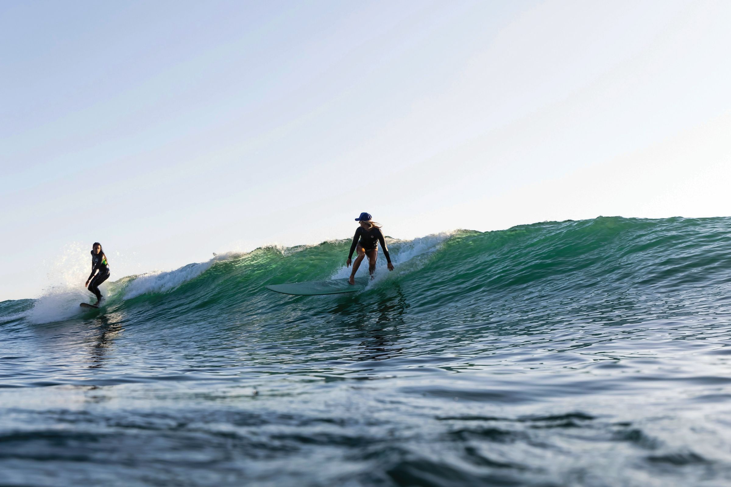 Women surfing together