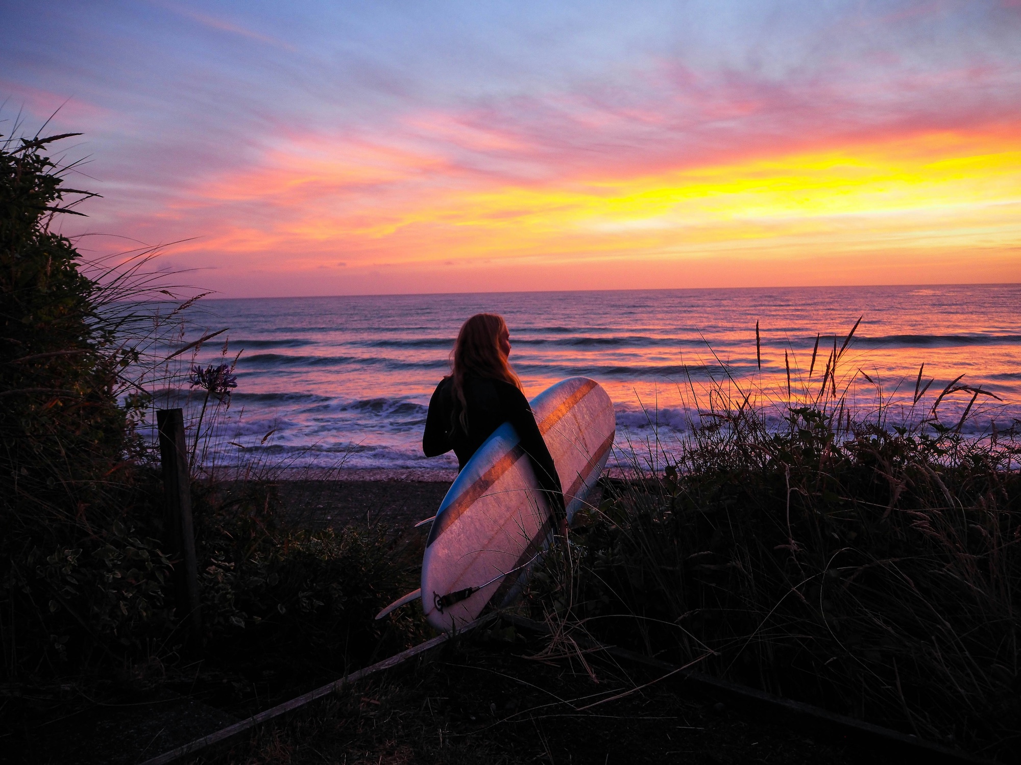 Surfer catching a clean, peeling wave