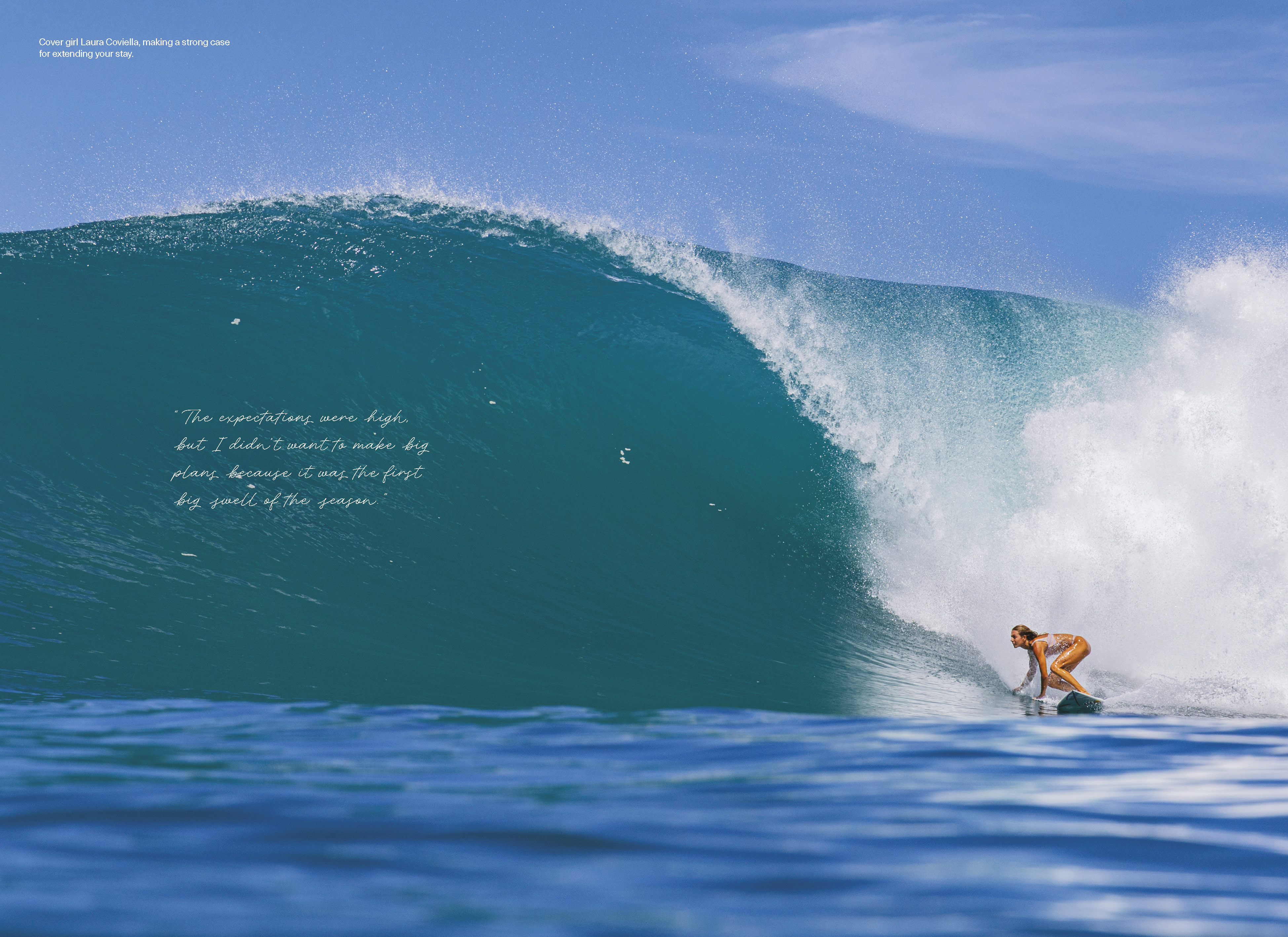 Magazine spread showing Laura Coviella crouched at the foot of a large, deep blue Mentawai barrel under a clear sky, with a handwritten quote on the wave face